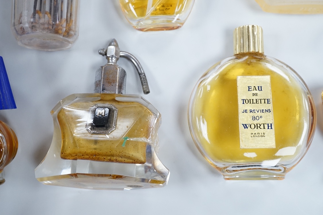 A Baccarat Guerlain perfume bottle in original box and a collection of other empty perfume bottles